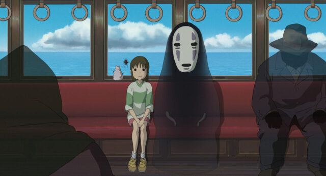 千尋とカオナシが電車に横並びに座っている画像